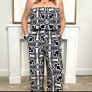 New with tags. Jumpsuit from Skies are Blue. Navy and taupe